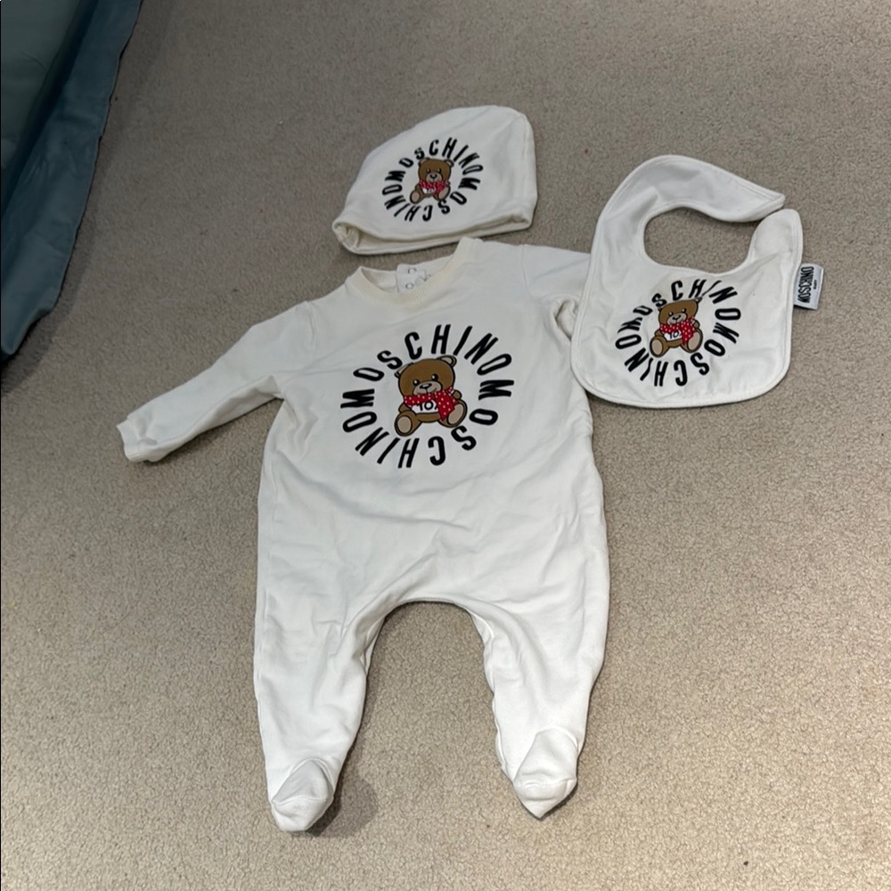 Moschino White Footies One Piece with Sunburst Design